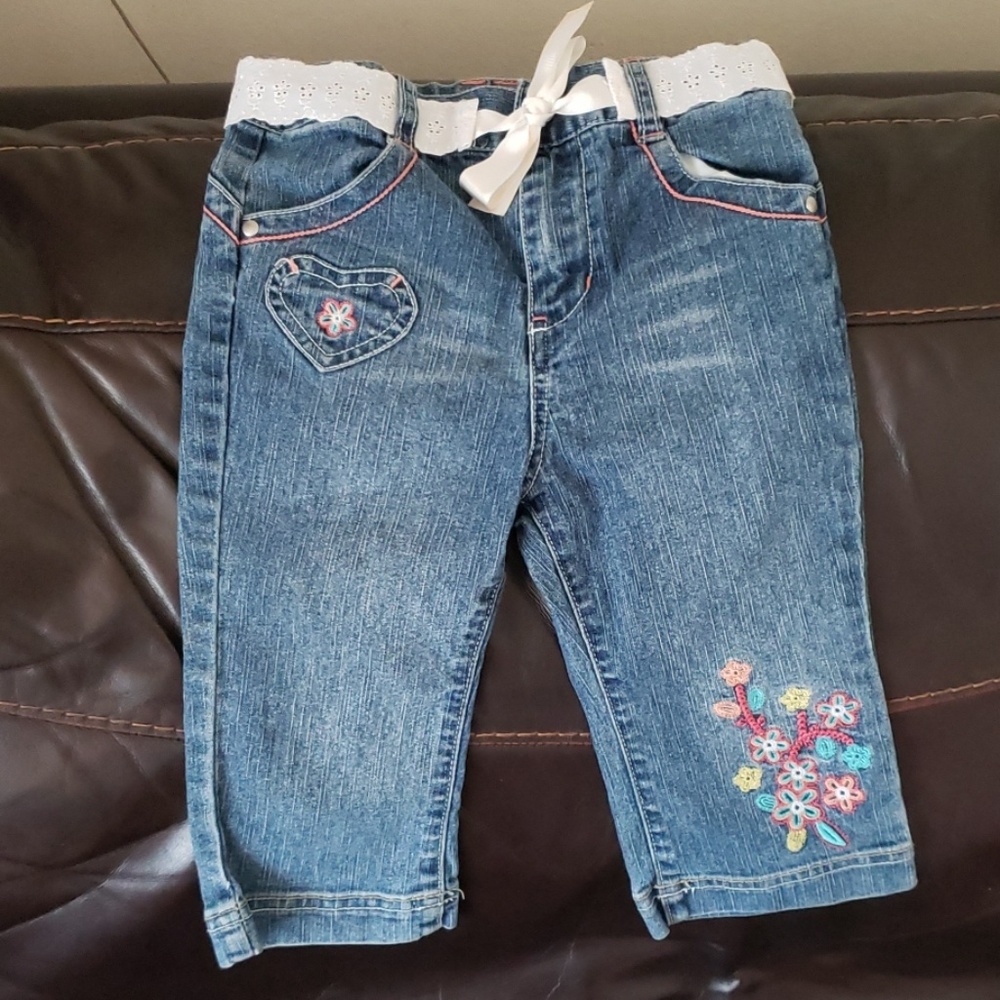 Embroidered jeans with fabric belt
